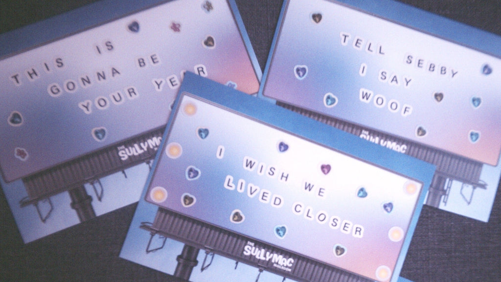 Set of four cards with text and heart designs on a dark background. Sully Mac Mailroom