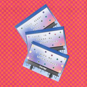 Sully Mac Mailroom greeting cards with text and heart designs on a pink and orange checkered background